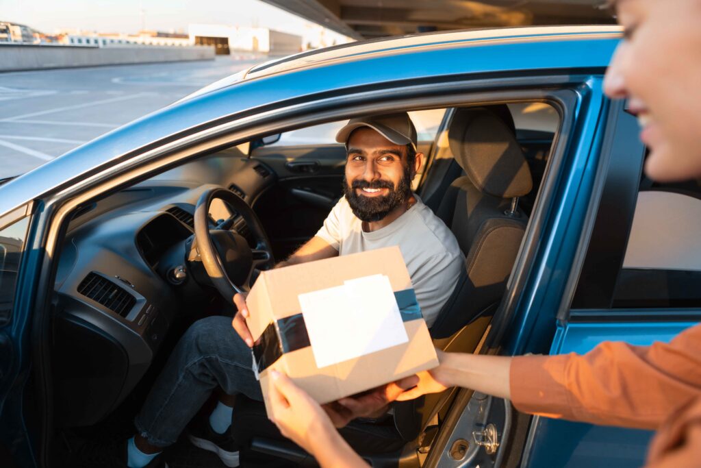 Driver giving lost items to Customers